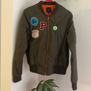 Olive green bomber jacket with patches
